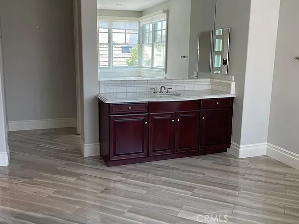 a bathroom with a sink and a mirror