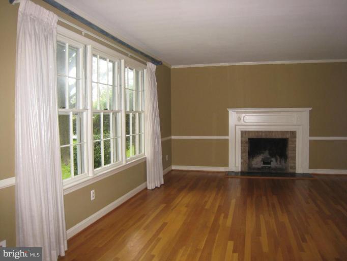 239 Providence Road Annapolis, MD 21409 - Photo 2 of 24 Living room highlighted by hardwood flrs & FP