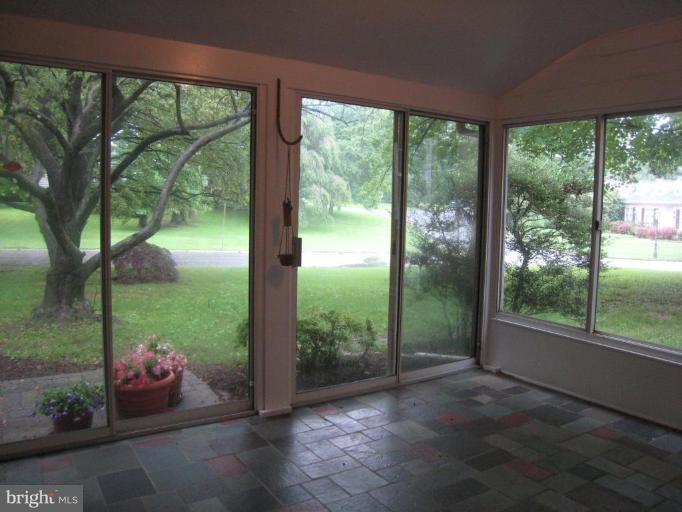 239 Providence Road Annapolis, MD 21409 - Photo 13 of 24 Enclosed porch w/ slate flr brings the outdoors in