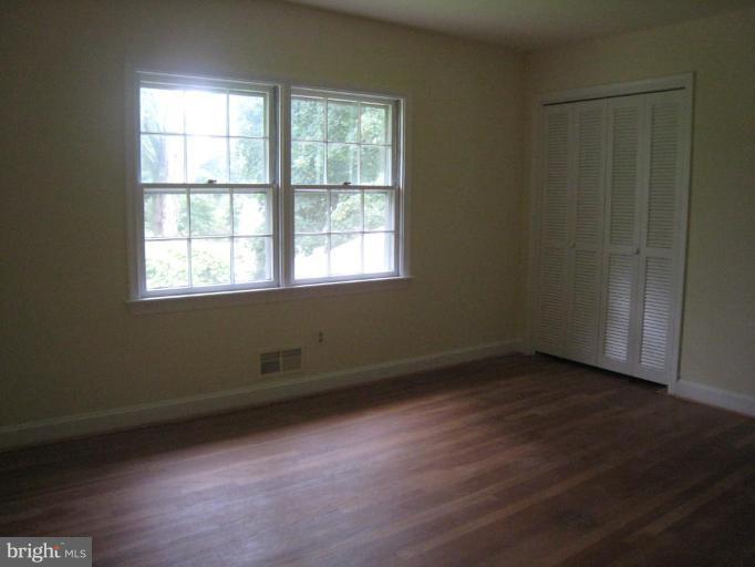 239 Providence Road Annapolis, MD 21409 - Photo 9 of 24 Fresh paint and hardwood floors in 3rd bedroom.