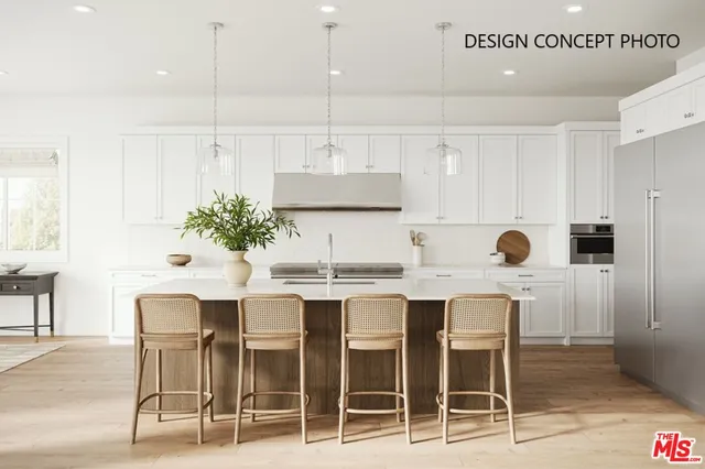 a kitchen with a table and chairs in it