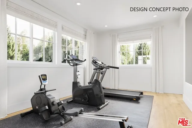 a room with gym equipment and a large window