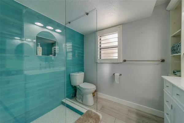 a bathroom with a sink a vanity and a mirror