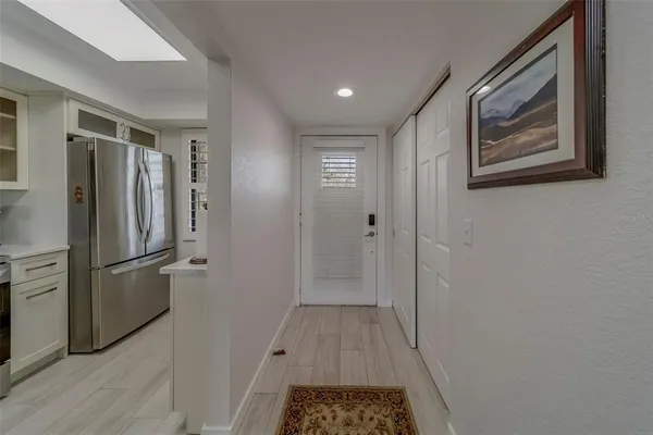 a kitchen with stainless steel appliances granite countertop a stove microwave and cabinets