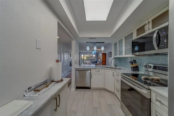 a kitchen with a sink and cabinets