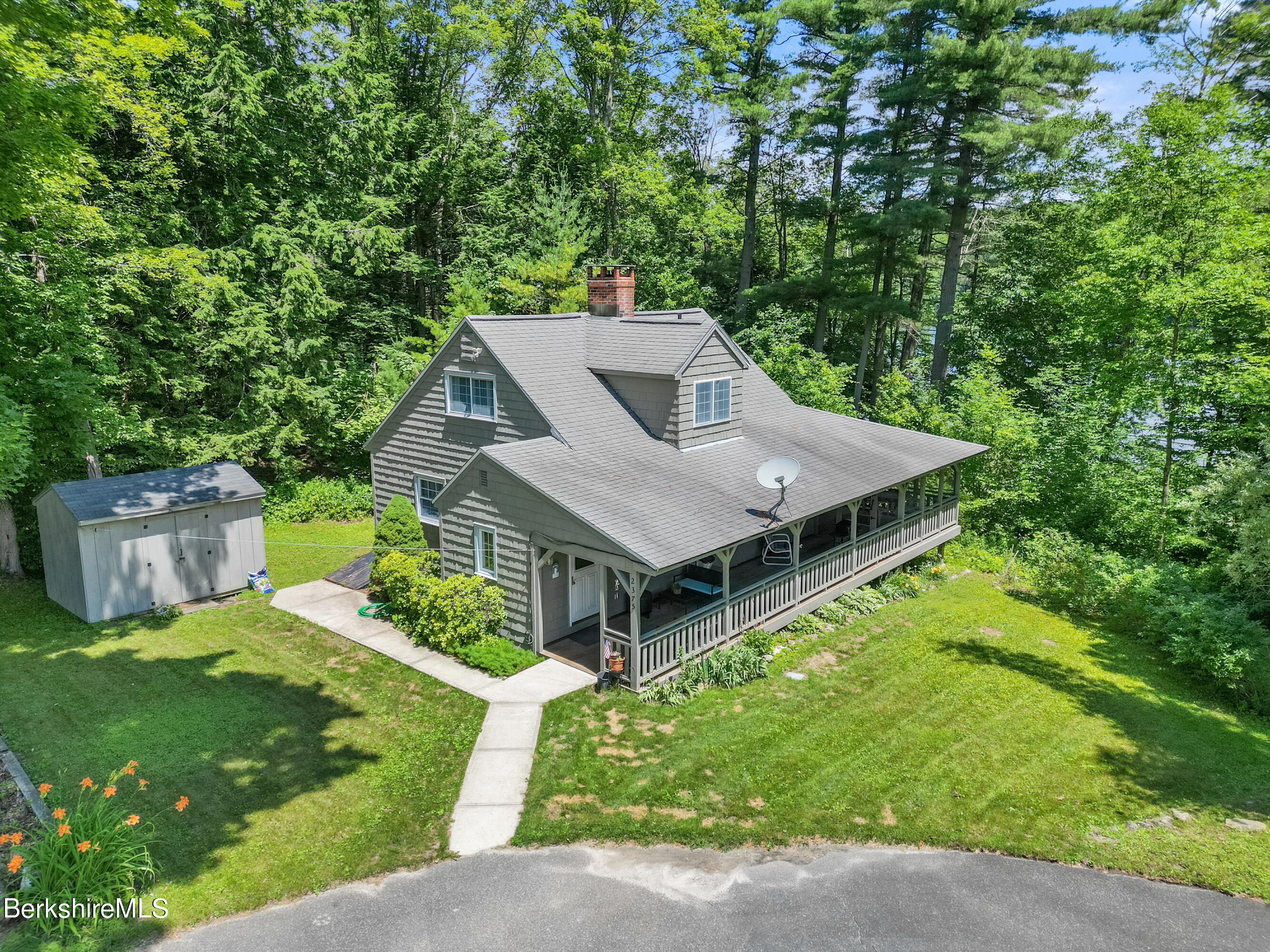 2375 North Main Road Otis, MA 01253 - Photo 1 of 31 a view of a house with a big yard plants and large trees