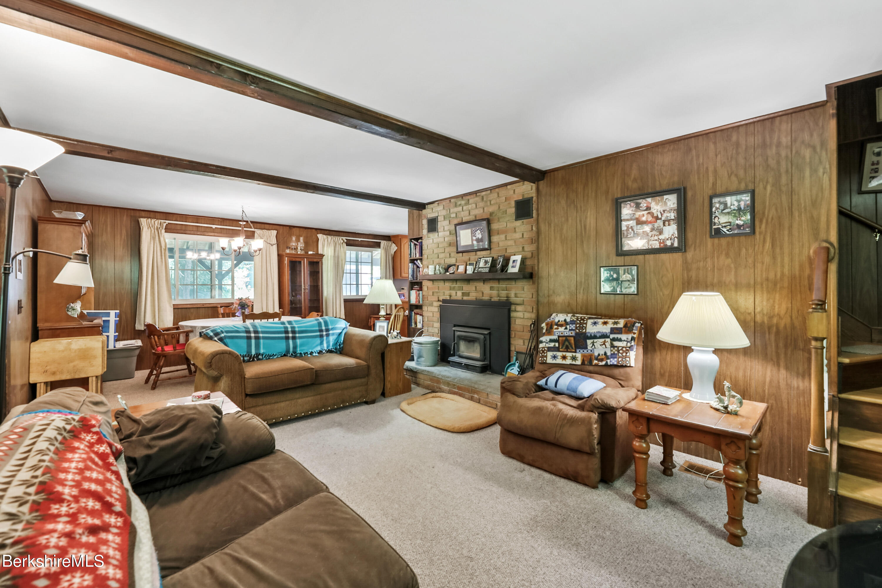 2375 North Main Road Otis, MA 01253 - Photo 18 of 31 a living room with furniture fireplace and a large window