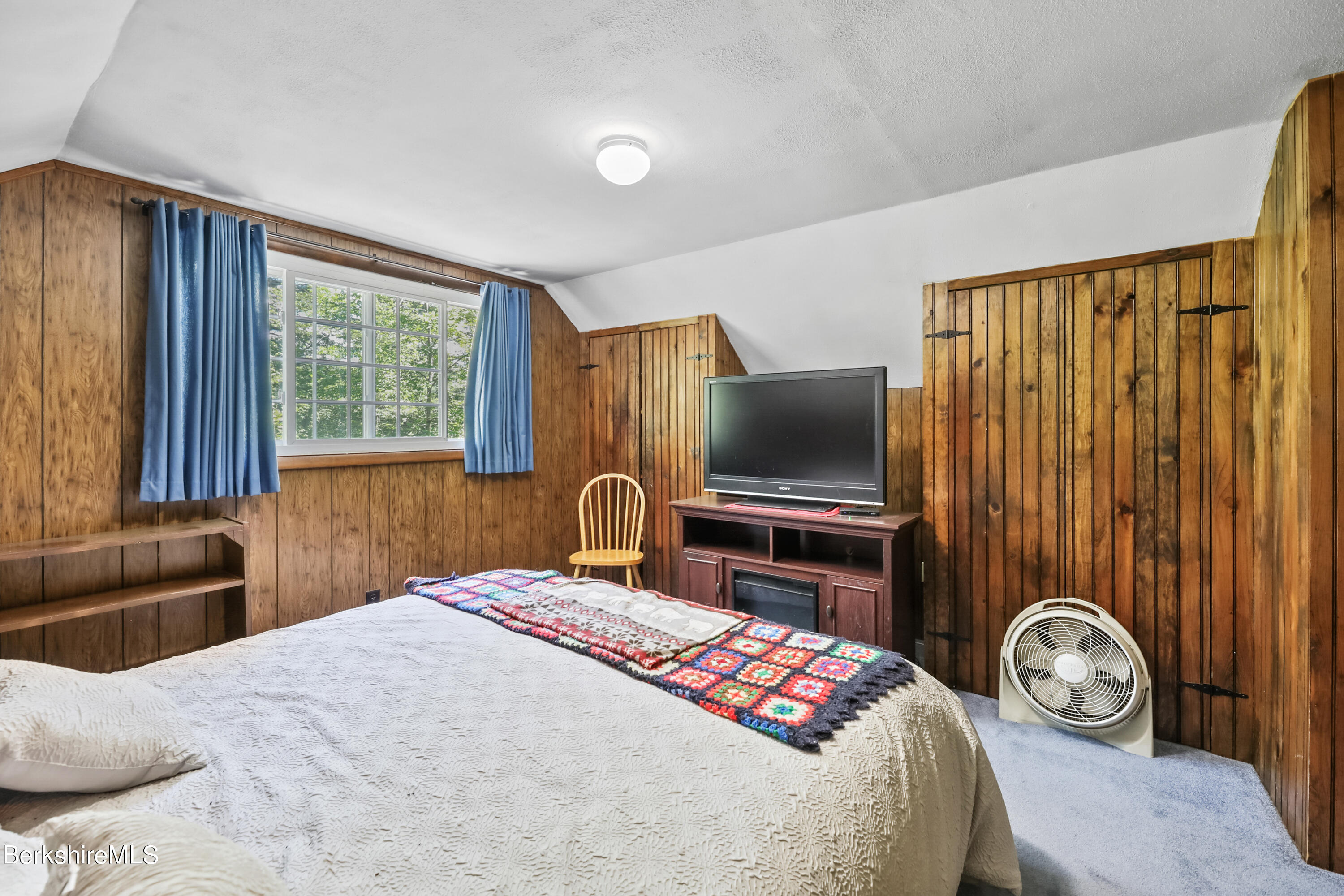 2375 North Main Road Otis, MA 01253 - Photo 28 of 31 a bedroom with a bed and a television