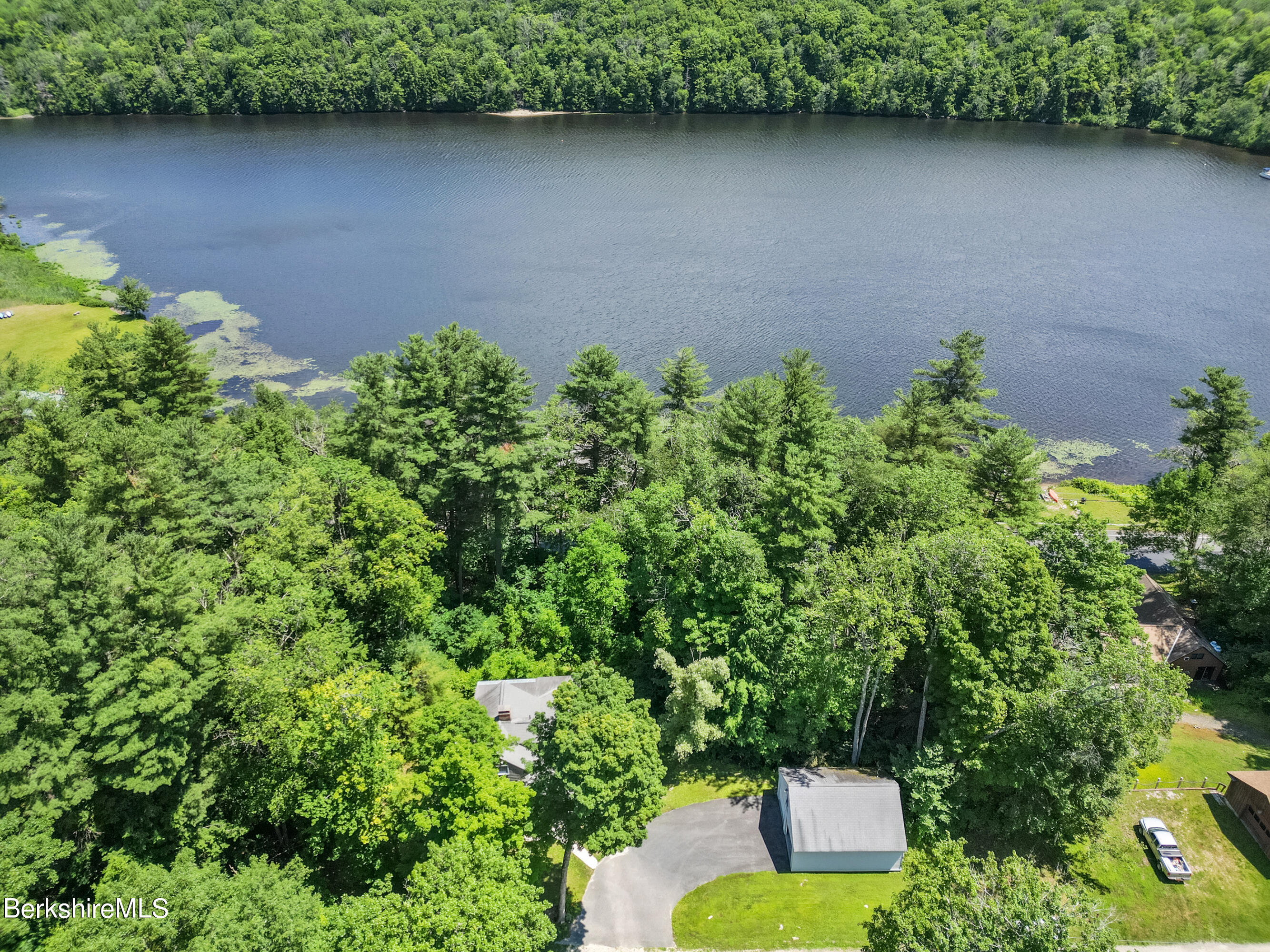 2375 North Main Road Otis, MA 01253 - Photo 6 of 31 an aerial view of a house with a yard and lake view