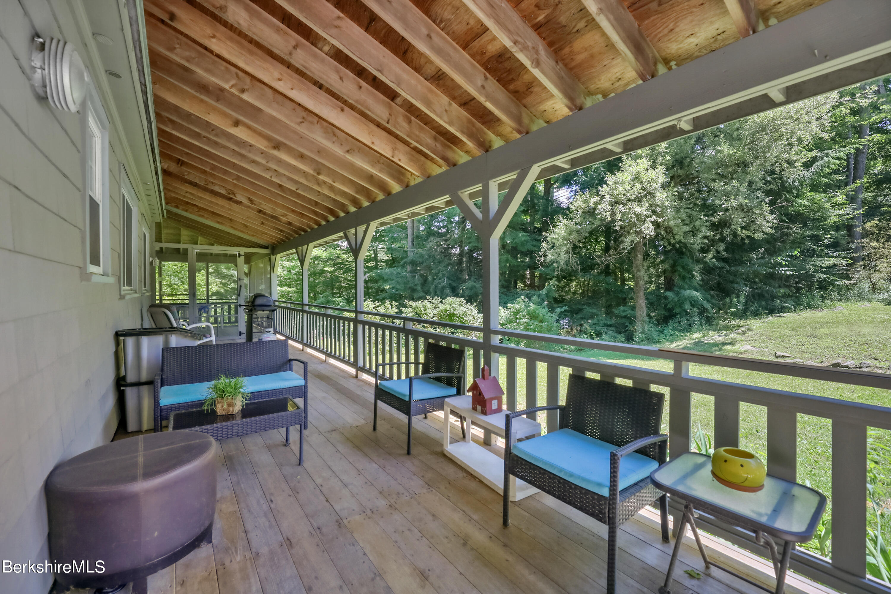2375 North Main Road Otis, MA 01253 - Photo 7 of 31 a view of a chair and table in the balcony
