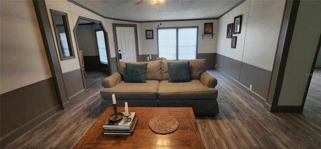 19865 Southwest 5th Place Dunnellon, FL 34431 - Photo 20 of 78 a living room with furniture and a wooden floor