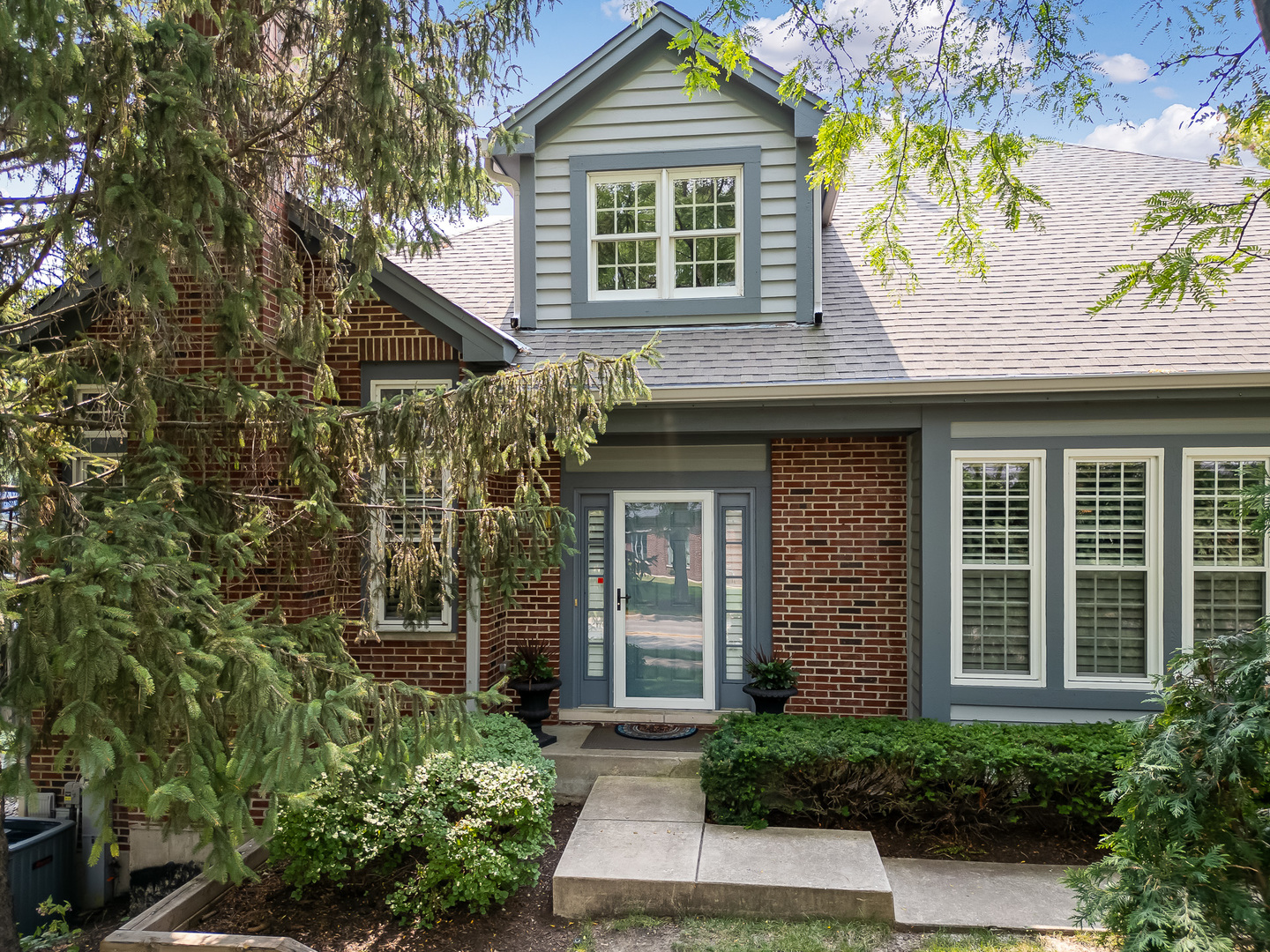 front view of a house with a yard
