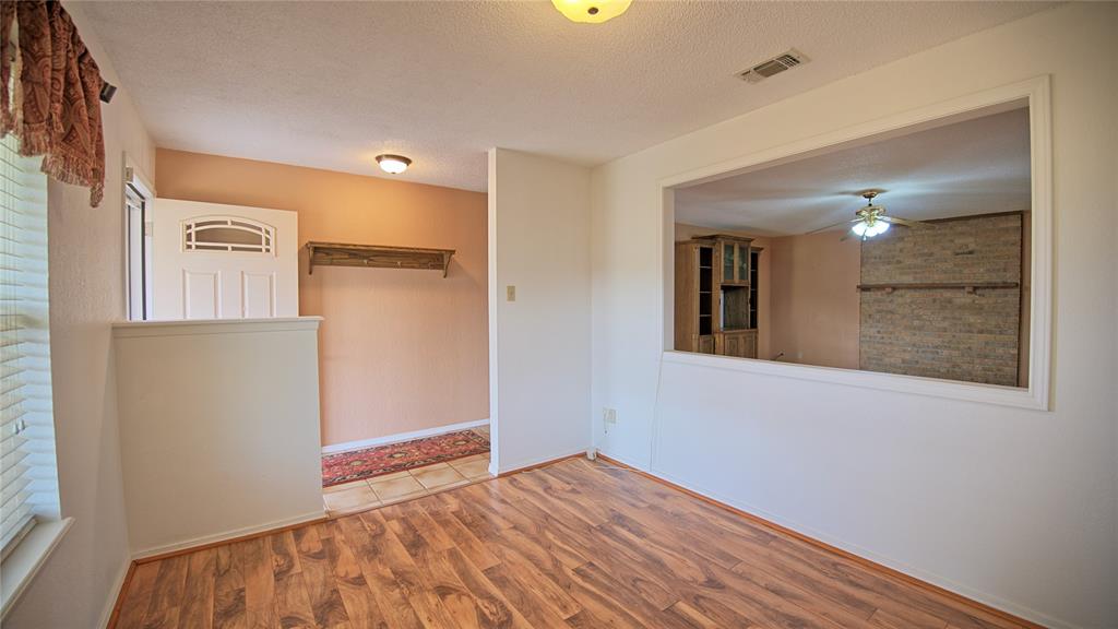 1740 Oakshores Road Nocona, TX 76255 - Photo 14 of 38 a view of empty room with wooden floor and fan