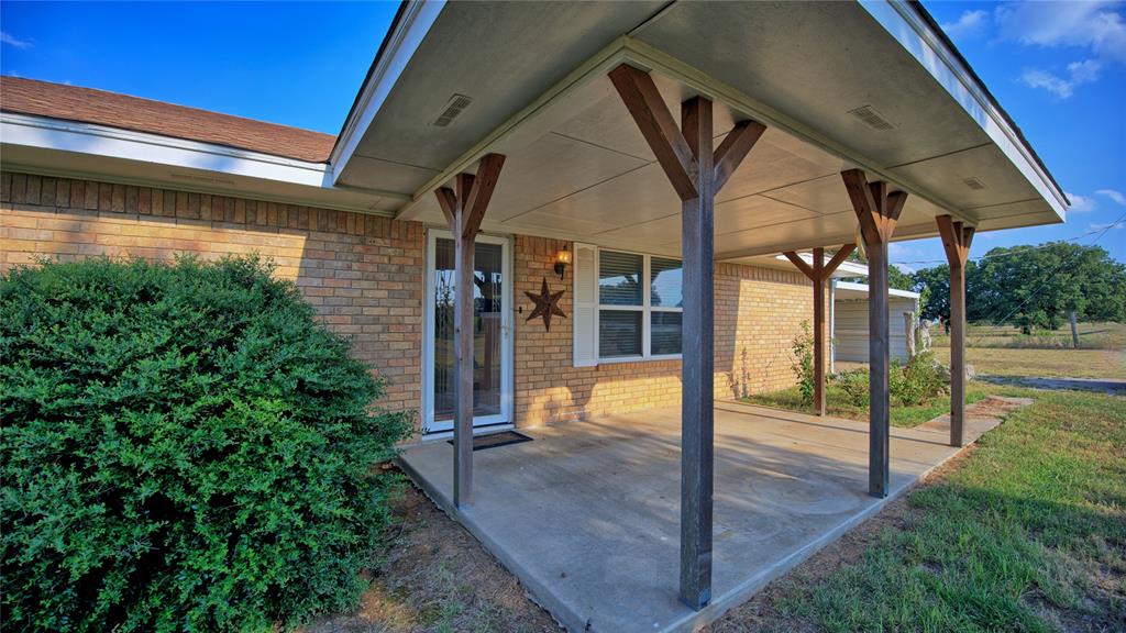 1740 Oakshores Road Nocona, TX 76255 - Photo 15 of 38 a view of a porch with a backyard