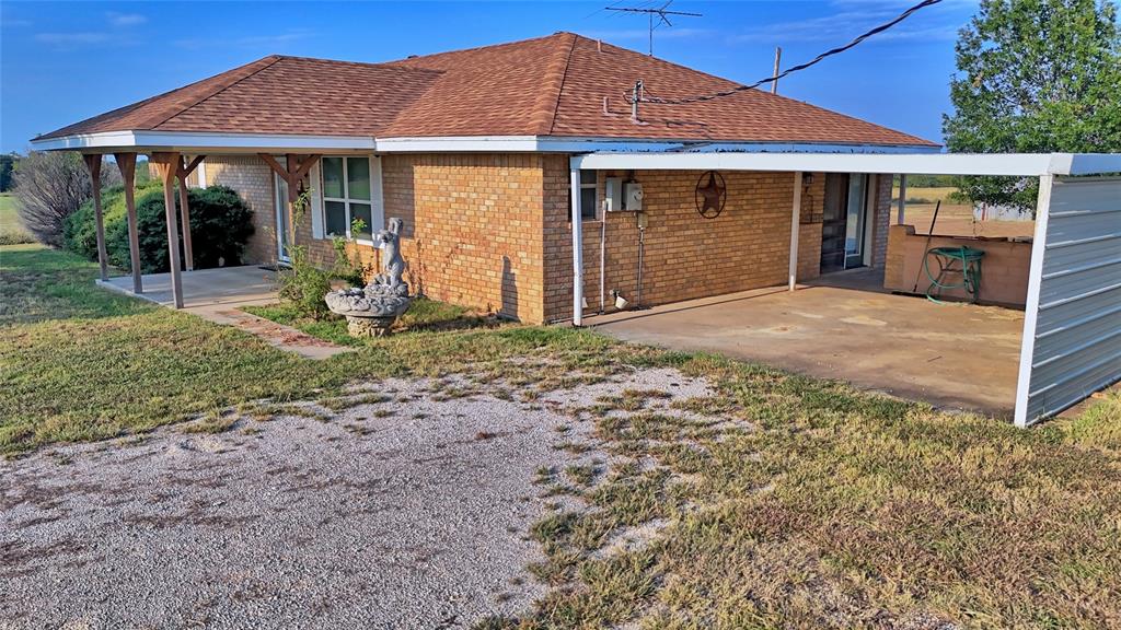 1740 Oakshores Road Nocona, TX 76255 - Photo 20 of 38 a front view of a house with a yard