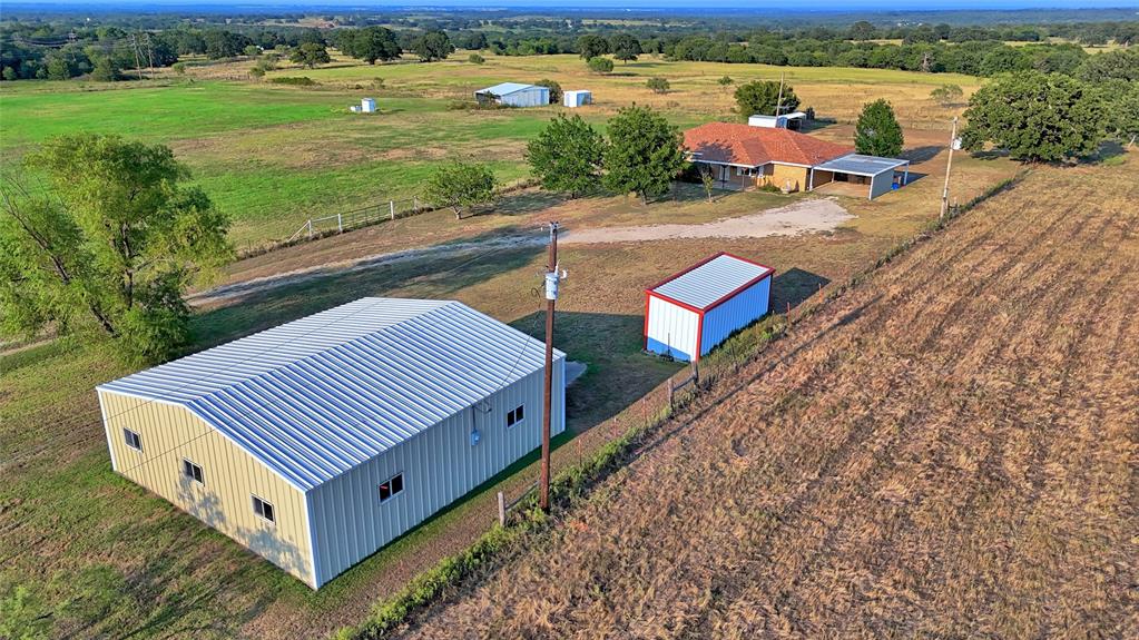 1740 Oakshores Road Nocona, TX 76255 - Photo 2 of 38 a view of a yard with furniture and garden