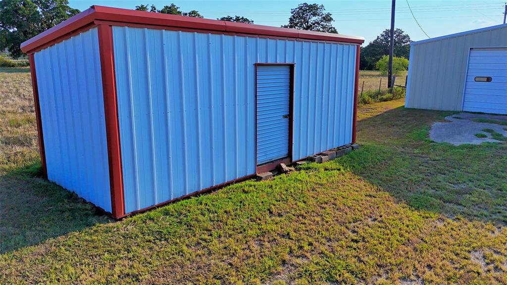 1740 Oakshores Road Nocona, TX 76255 - Photo 22 of 38 a view of a backyard with potted plants