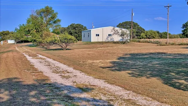a view of a backyard of the house