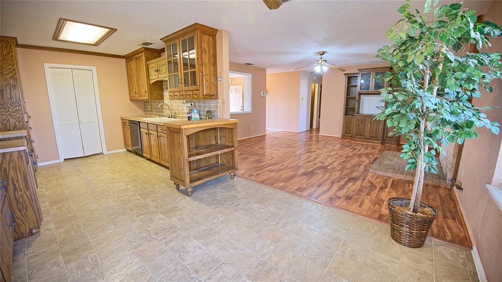 1740 Oakshores Road Nocona, TX 76255 - Photo 29 of 38 a spacious bedroom with a bed and a mirror