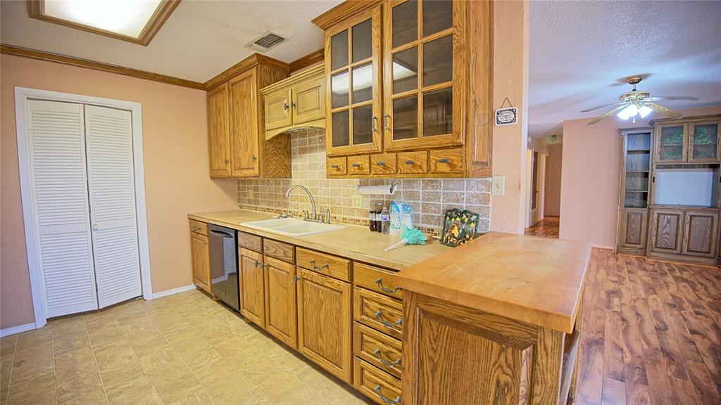 1740 Oakshores Road Nocona, TX 76255 - Photo 3 of 38 a bathroom with a sink and a mirror