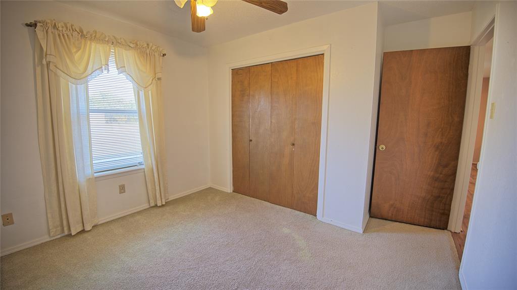 1740 Oakshores Road Nocona, TX 76255 - Photo 33 of 38 an empty room with windows and closet