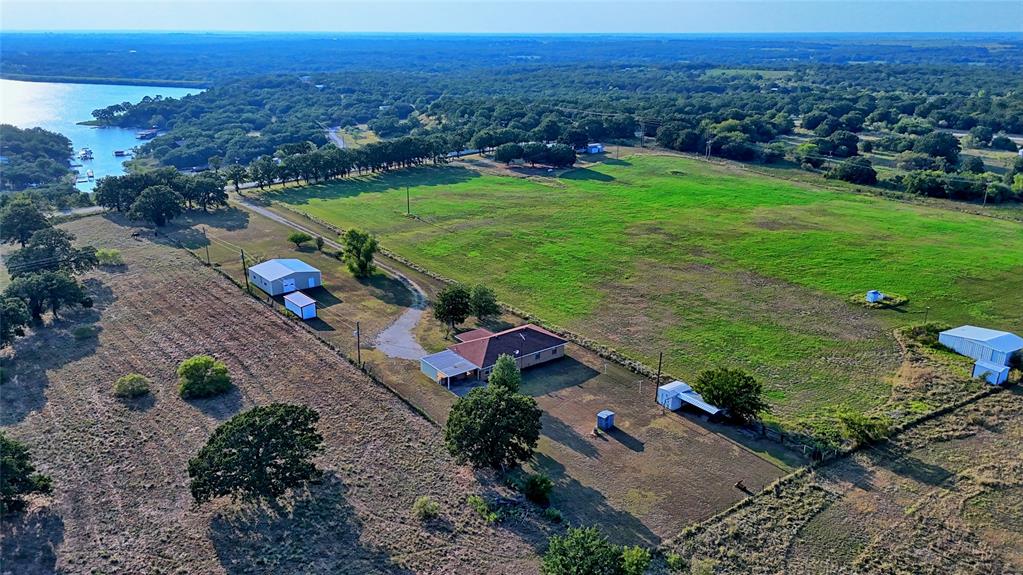 1740 Oakshores Road Nocona, TX 76255 - Photo 35 of 38 an aerial view of a house with a yard
