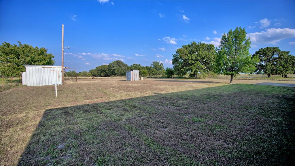 1740 Oakshores Road Nocona, TX 76255 - Photo 36 of 38 a view of a yard with a house