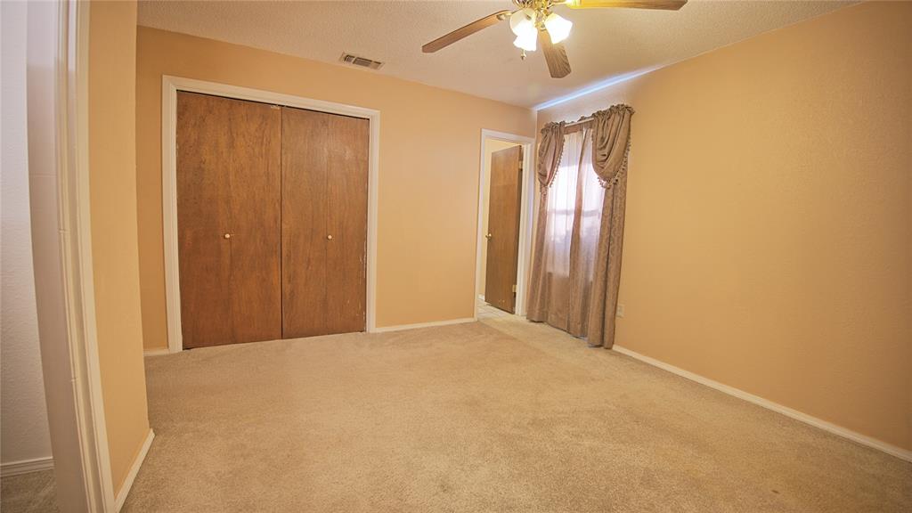 1740 Oakshores Road Nocona, TX 76255 - Photo 37 of 38 a view of a livingroom with a chandelier fan