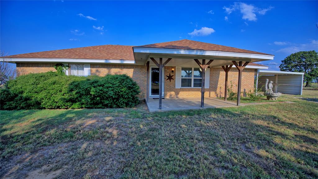 1740 Oakshores Road Nocona, TX 76255 - Photo 4 of 38 a front view of a house with porch
