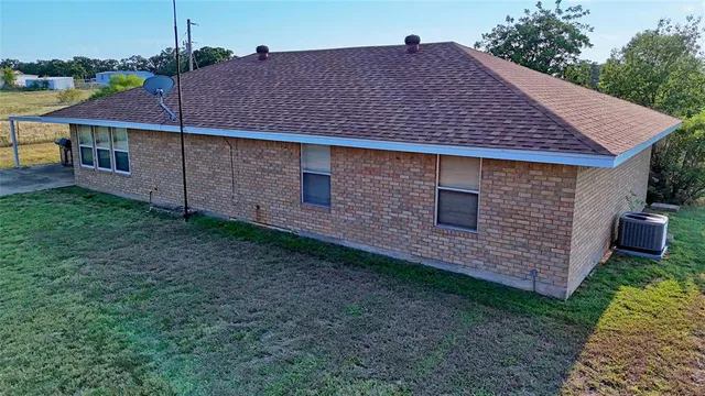 a aerial view of a house with a yard