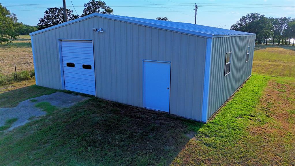 1740 Oakshores Road Nocona, TX 76255 - Photo 8 of 38 a view of a backyard