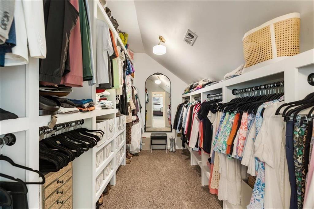 3910 Two Rivers Drive Cumming, GA 30041 - Photo 50 of 110 a view of walk in closet with clothes and shoes