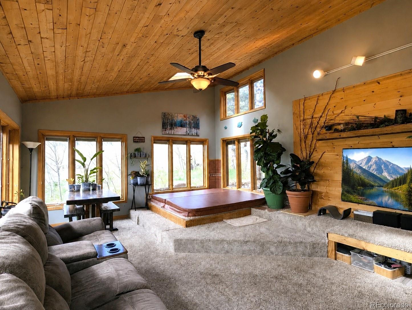 2084 Forbes Park Road Fort Garland, CO 81133 - Photo 14 of 39 a living room with furniture and a flat screen tv
