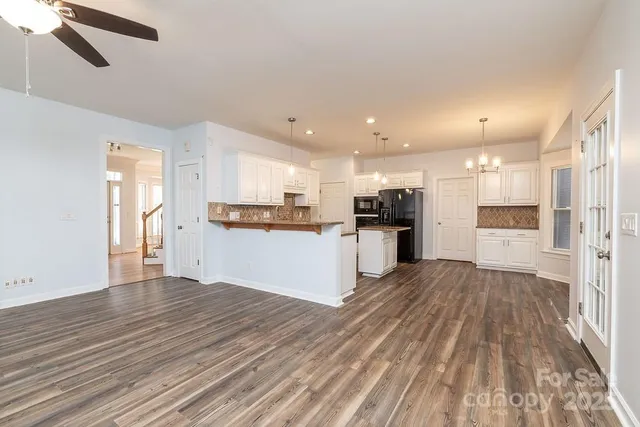 a view of kitchen with wooden floor