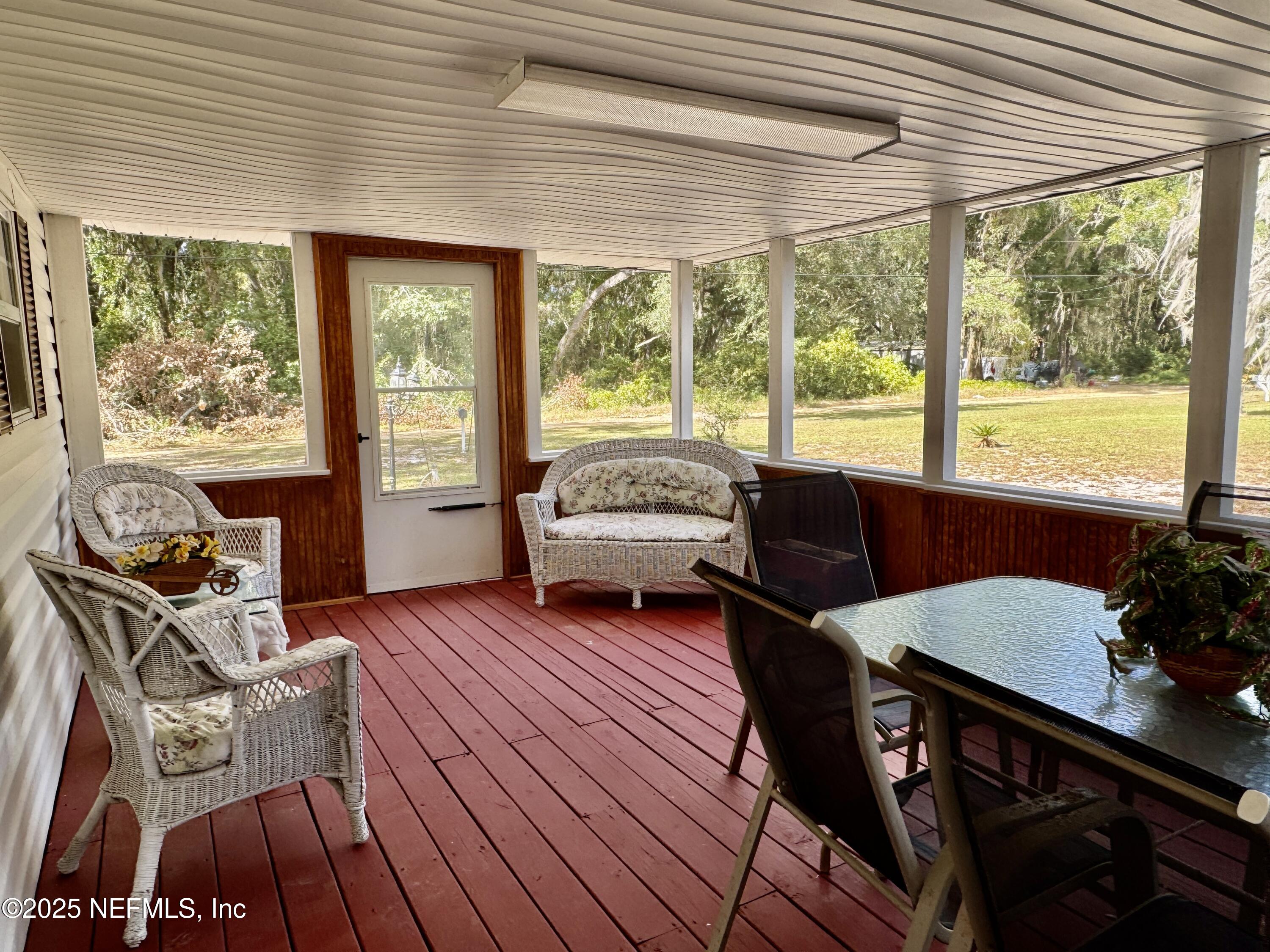 106 Helen Avenue Interlachen, FL 32148 - Photo 7 of 43 large screen porch