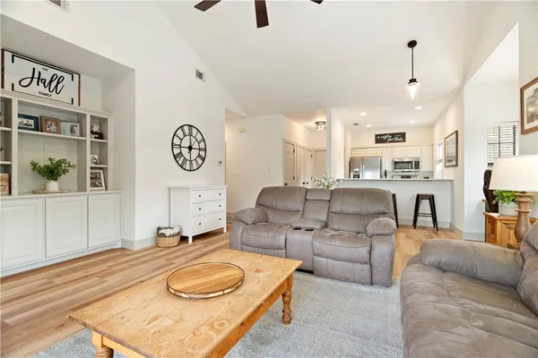 a living room with furniture and a table