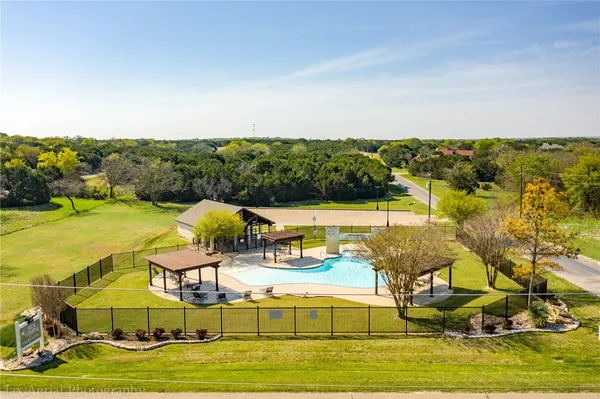 a view of a swimming pool with an ocean view