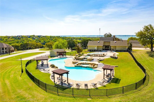 a view of a swimming pool with seating area
