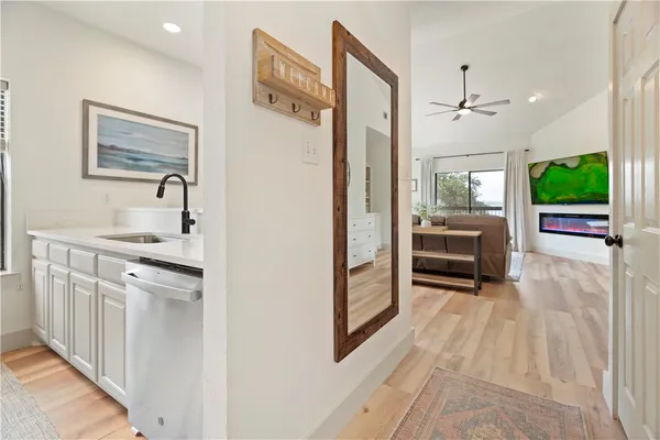 a kitchen with stainless steel appliances granite countertop a refrigerator and a sink