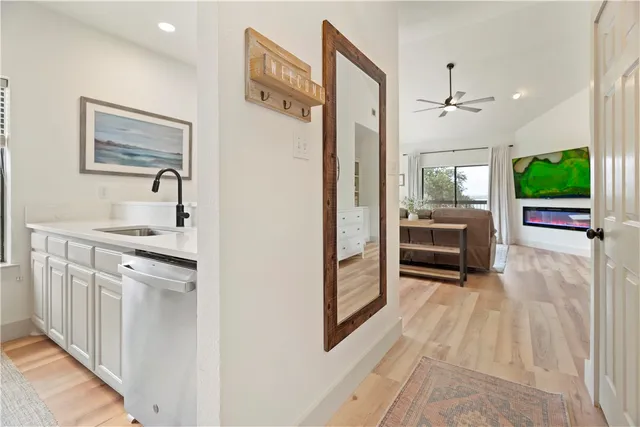 a kitchen with stainless steel appliances granite countertop a refrigerator and a sink