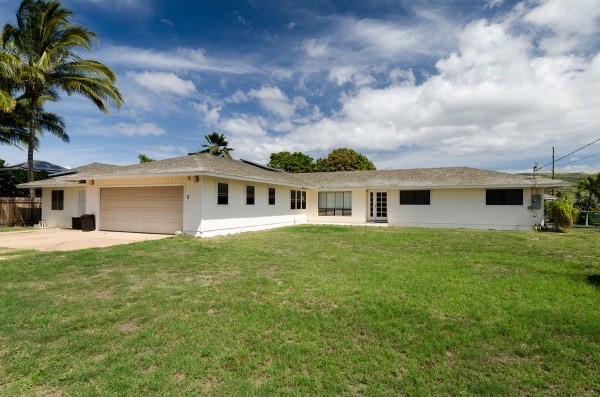 7935 Ulili Road Kekaha, HI 96752 - Photo 1 of 20 a front view of a house with a garden
