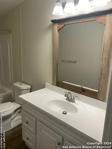 a bathroom with a sink and a toilet