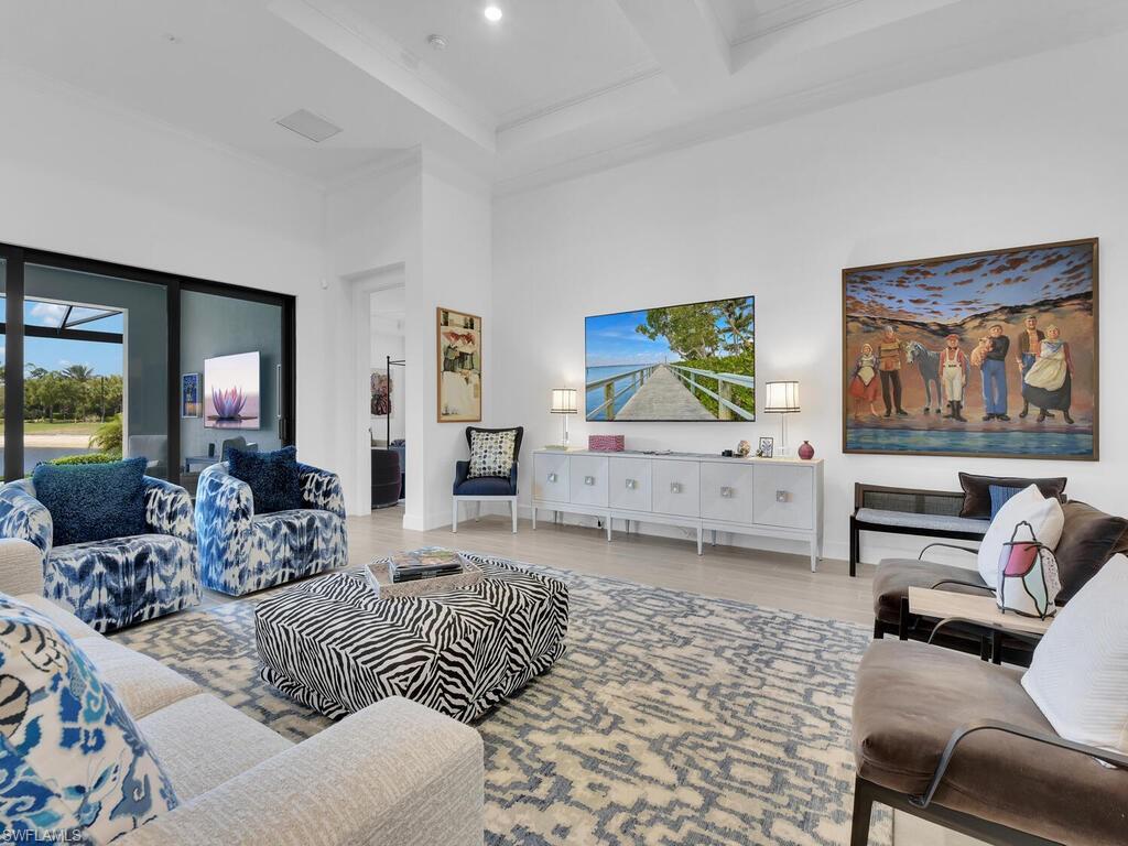 7229 Wiregrass Court Naples, FL 34114 - Photo 12 of 40 a living room with furniture and a couch