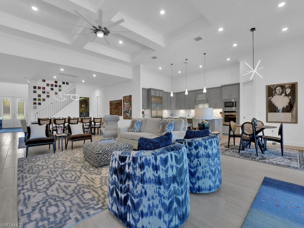 7229 Wiregrass Court Naples, FL 34114 - Photo 13 of 40 a living room with lots of furniture and view of kitchen