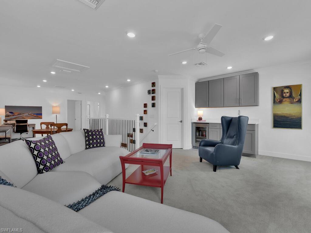 7229 Wiregrass Court Naples, FL 34114 - Photo 26 of 40 a living room with furniture or kitchen and a couch