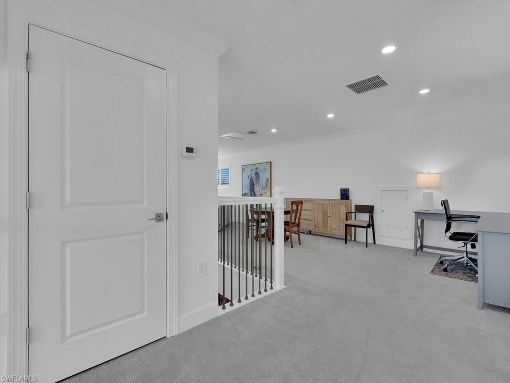 7229 Wiregrass Court Naples, FL 34114 - Photo 29 of 40 a view of a livingroom with table and chairs