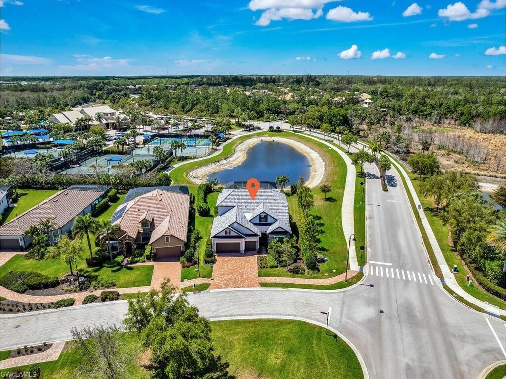 7229 Wiregrass Court Naples, FL 34114 - Photo 3 of 40 an aerial view of residential houses with outdoor space and swimming pool