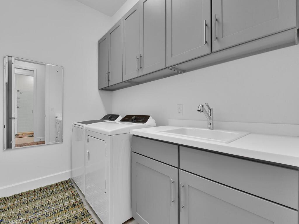 7229 Wiregrass Court Naples, FL 34114 - Photo 34 of 40 a utility room with cabinets