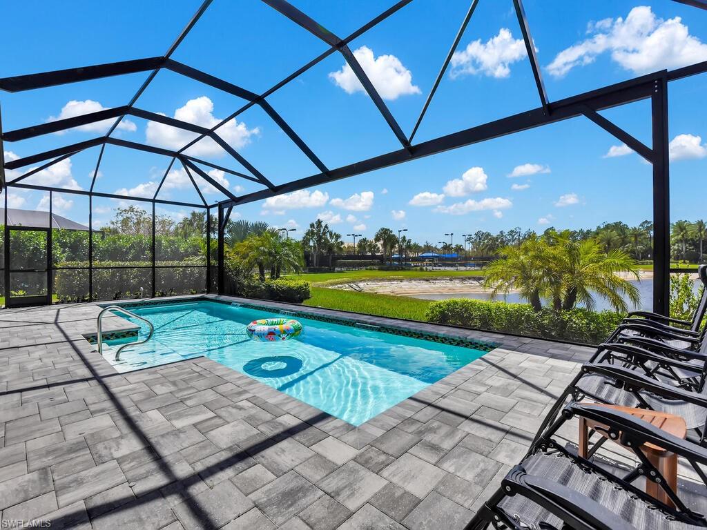 7229 Wiregrass Court Naples, FL 34114 - Photo 39 of 40 a view of swimming pool with a patio