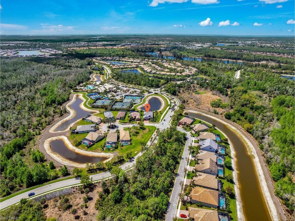7229 Wiregrass Court Naples, FL 34114 - Photo 4 of 40 an aerial view of a house with outdoor space